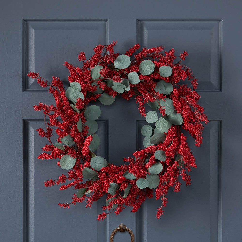 23.5" POINSETTIA/BERRY/EUCALYPTUS HALF WREATH