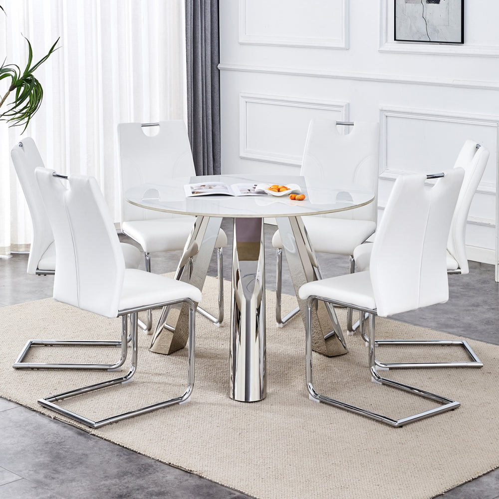 Table and chair set.A 42-inch stainless steel leg round table .Paired with 6 Uniquely designed White Dining Chairs With Silver Metal Leg.Sintered Stone Tabletop,Stainless Steels Table Legs.