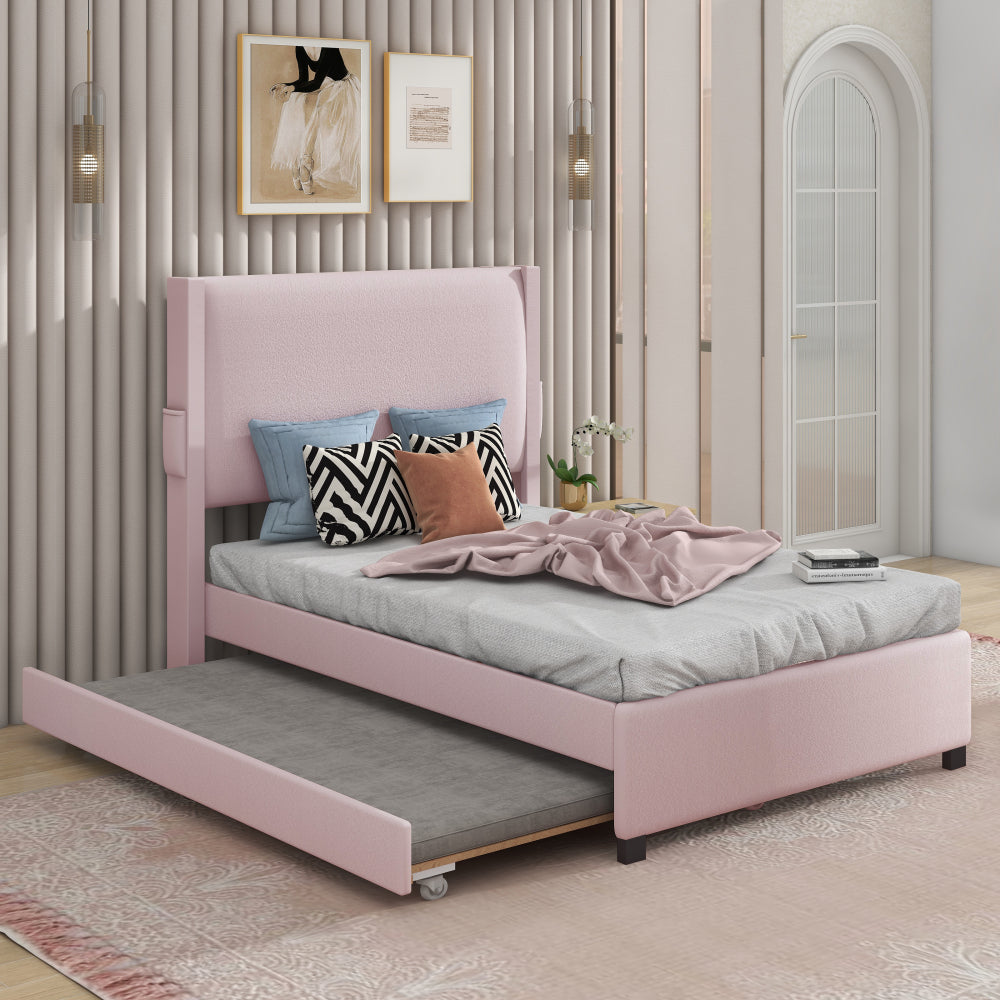 PINK TWIN SIZE UPHOLSTERED BED FRAME WITH TRUNDLE BED, TEDDY FABRIC, USB FUNCTIONALITY, AND A POCKET DESIGN ON THE SIDE OF THE HEADBOARD FOR STORING SMALL ITEMS. PINK IS A GIRL'S FIRST CHOICE!